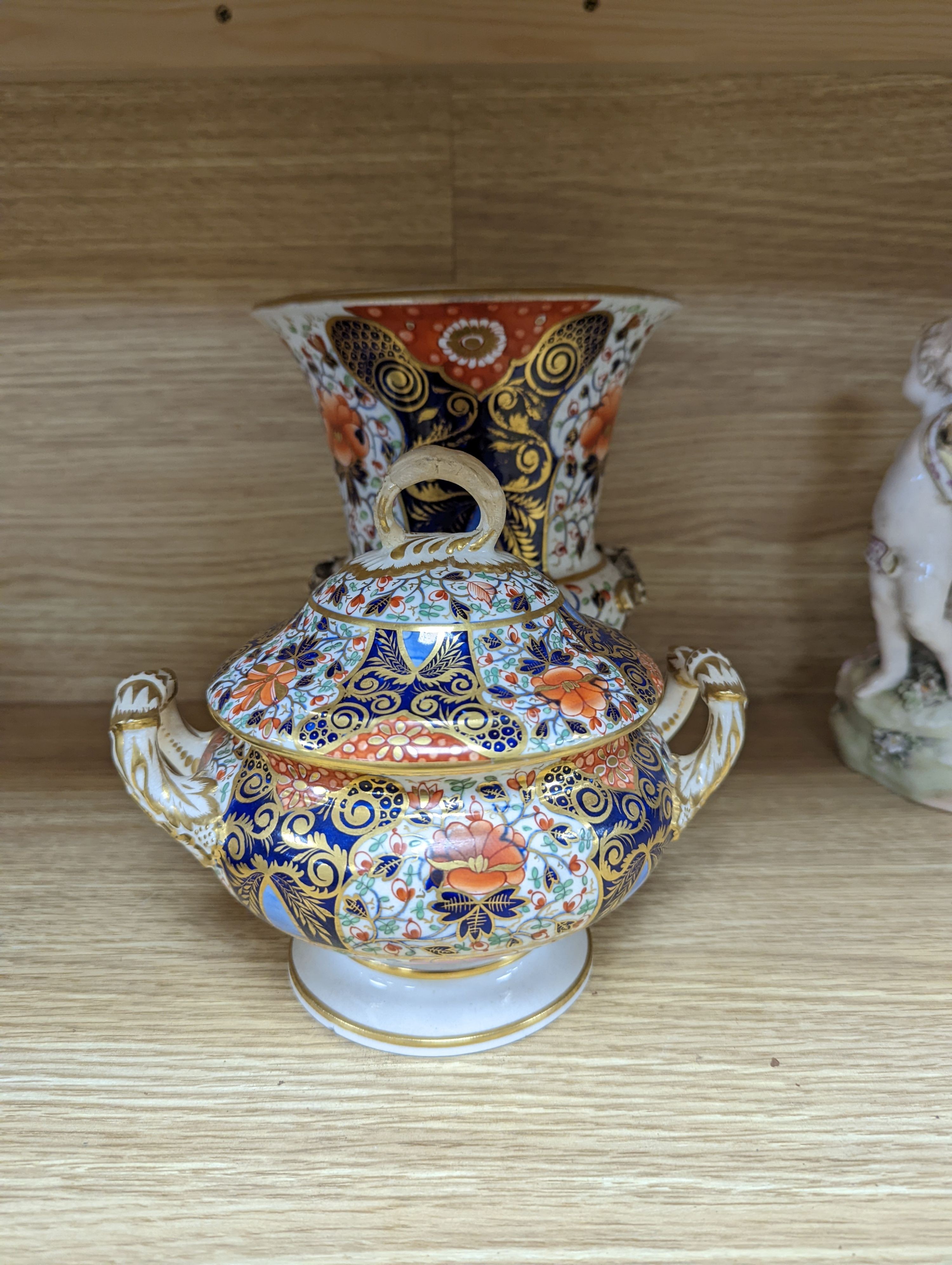 Two Chelsea Derby figure groups, three Derby Japan-pattern items to include an ice pail and two sucrier, together with a Copeland porcelain model of a tower
